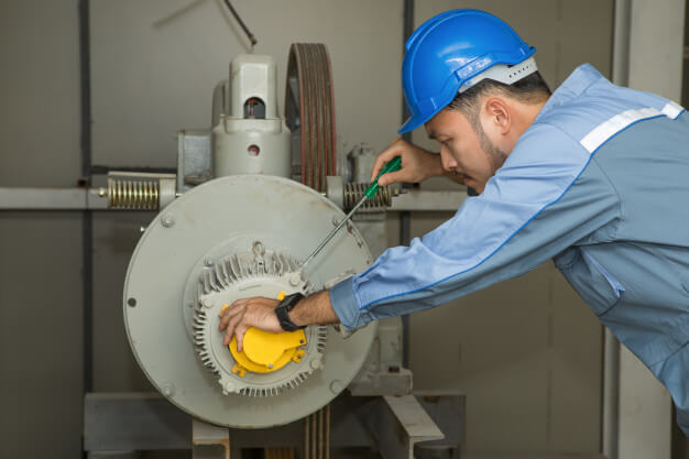 maintenance engineer repairing lift motor elevators 34755 135
