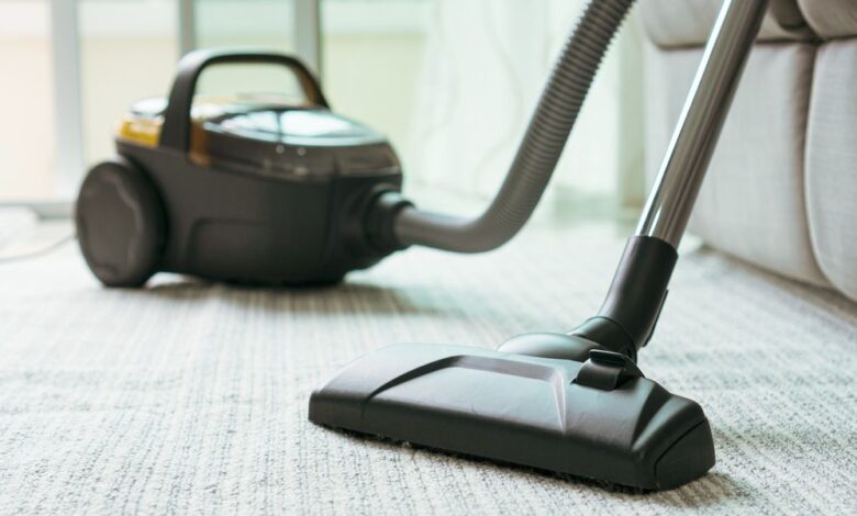 close up of vacuum cleaner in living room royalty free image 1617746688