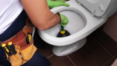 Man plunging toilet with tools 1024x683 1024x683 1