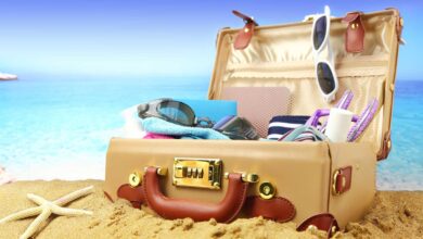 bigstock Full open suitcase on tropical 63865936